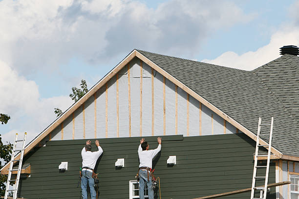 Professional Siding technician working in Massey, MD